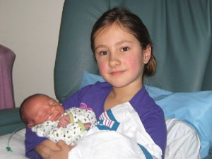 The proud Lilliana, holding her beautiful, sweet baby brother, Julian